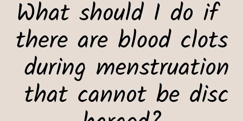 What should I do if there are blood clots during menstruation that cannot be discharged?