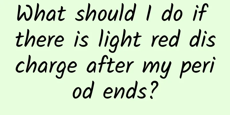 What should I do if there is light red discharge after my period ends?