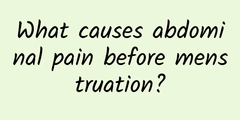 What causes abdominal pain before menstruation?